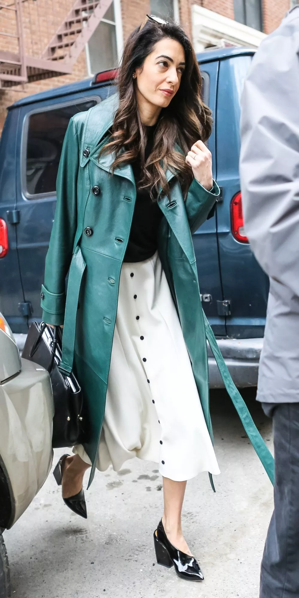 Amal Clooney’s Spring Wardrobe Features the Chicest Raincoat We’ve Ever Seen